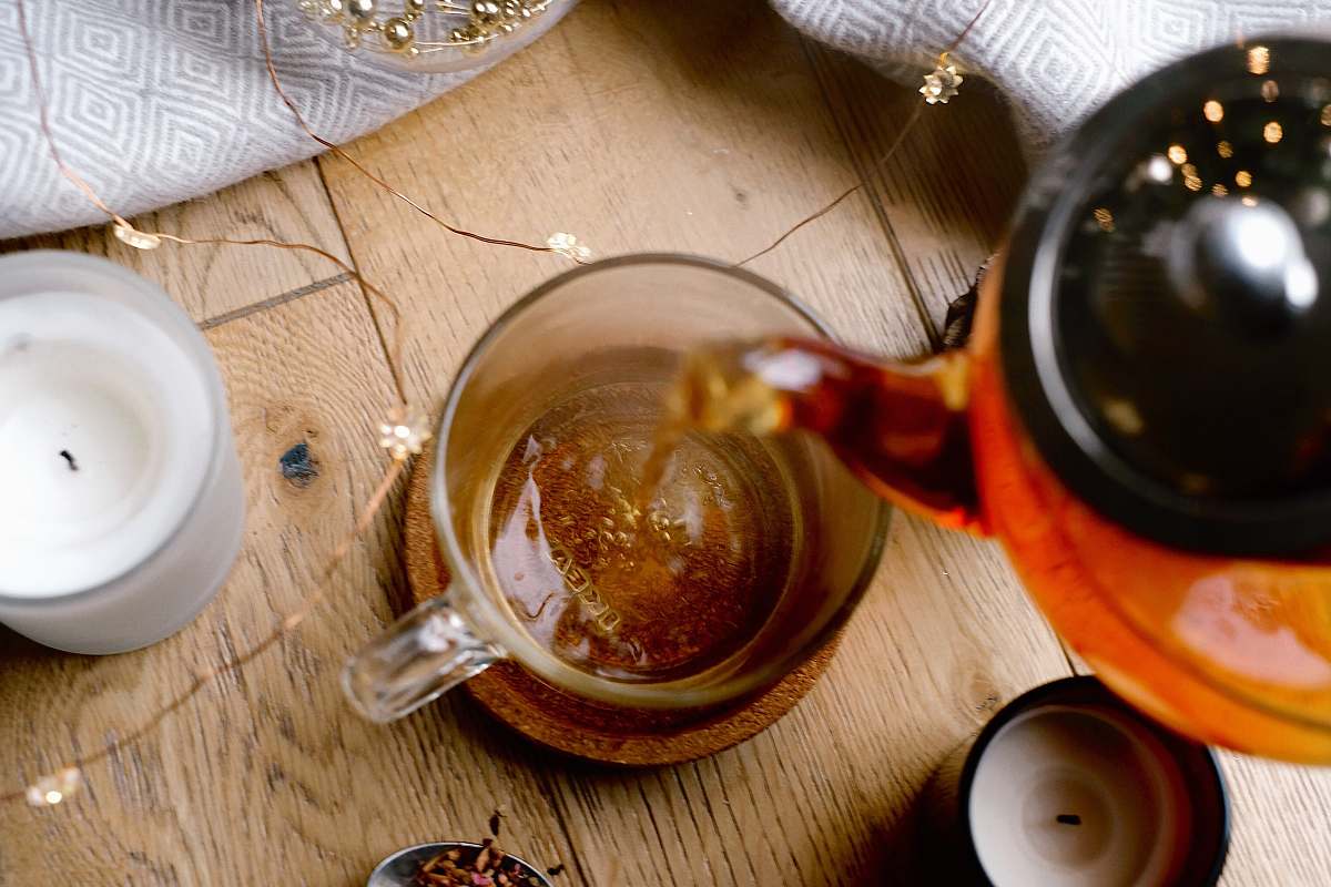 coffee cup person pouring liquid in mug drink